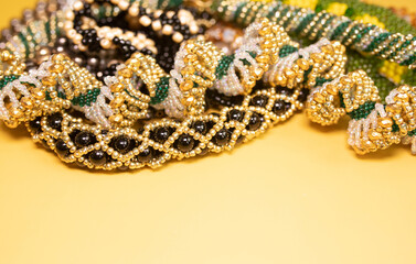 Beads, Jewelery, beads necklace on yellow background. 