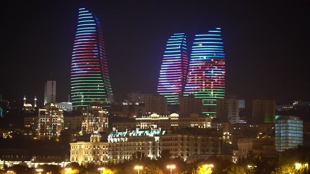 The famous flame Towers building in Baku is painted in different colors at night.