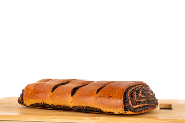 One appetizing roll with poppy seeds, macro, isolated on white background.