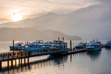 Fototapeta premium Sunrise view of yacht Marina in Sun Moon Lake, Nantou, Taiwan. it's a famous attraction in Taiwan.