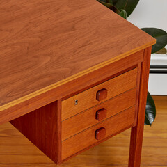 Writing desk 1960s in teak wood with drawers. Modern Scandinavian furniture. Top view with drawers interior photograph.