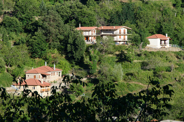 Fototapeta na wymiar Houses on the mountain Aroania in Zarouhla village. Achaia, Greece ...