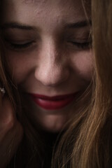 Fototapeta premium Face portraits of young beautiful girl. Hands near the face. Closed eyes. Happy girl have a fun