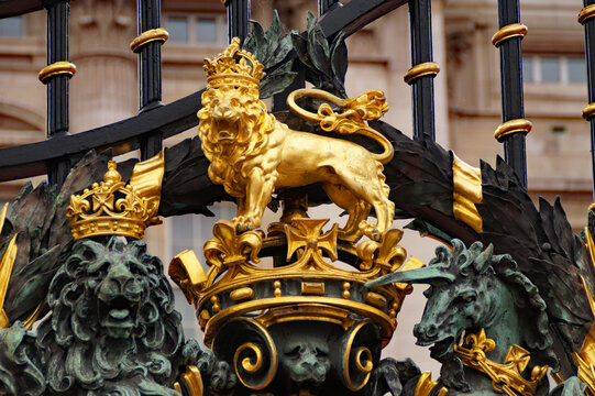 beautiful royal insignia of the Royal British family on the gates of Buckingham Palace, a London royal residence and the administrative headquarters of the monarch of the United Kingdom