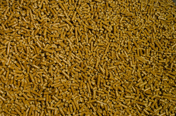 Background of pellets with bright brown colors.