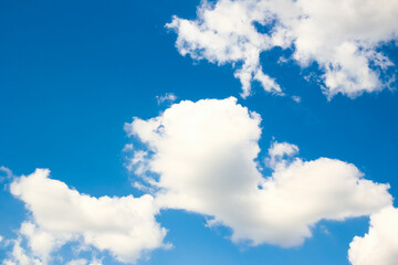 Fantastic soft white clouds against blue sky