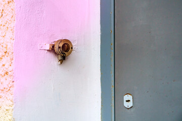 Vintage switch near metal door grey color