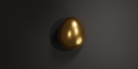 The Golden egg, the best idea, the origin. Golden shiny egg on black surface. Concept.