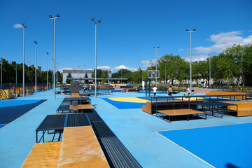 Teenagers plays streetball at new sport zone at expocenter, Kyiv, Ukraine