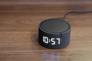Home voice assistant on the table. Talking stylish radio station for communication with a person....