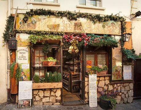 PARIS, FRANCE - MAY 07, 2011:  Exterior view of  the pretty Le Poulbot Restaurant Cafe in Rue Poulbot road