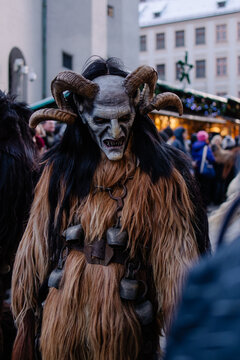 Procession of the Krampus Bavarian tradition in Germany. Costume parade fashing procession. Scary demon make-up with horns for halloween. Zombie parade. Terrible scary masks. Folk German folklore