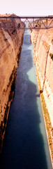 The Corinth Canal, inaugurated in 1893, is an artificial waterway dug through the Isthmus of Corinth, Greece. With a depth of 8 m and a width of 25 m for a length of 6.343 km, it connects the Ionian S