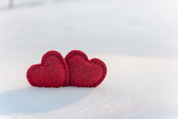  Two Red hearts on snow in winter. Happy valentines day celebration. Heart love concept.