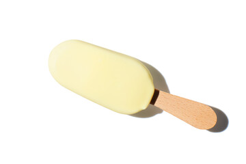 vanilla ice cream on a stick on green pastel background - obrazy, fototapety, plakaty