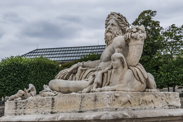 Fototapeta na wymiar The ancient Sculpture in Paris Jardin des Tuileries (Tuileries garden). Garden was created by Catherine de Medici in 1564. Paris, France.