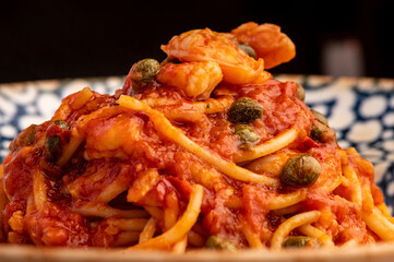 spaghetti with sauce and capers