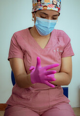 female dentist  using dental instruments