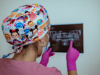 female dentist  using dental instruments