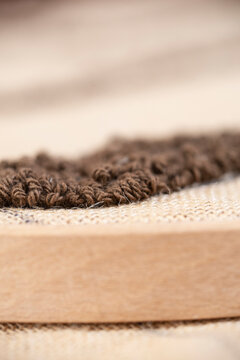 Close-up of punch needle embroidery on an embroidery hoop