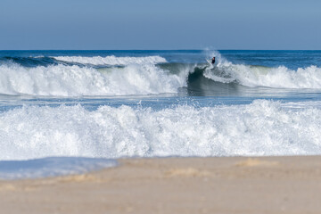 Bodyboarder surfing ocean wave