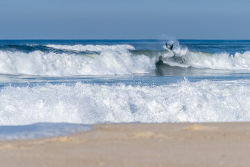 Bodyboarder surfing ocean wave