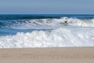 Bodyboarder surfing ocean wave
