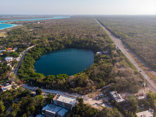 Aerial Drone Shot of Beautiful Cenote Azul and view on 7 seven colors lagoon in Bacalar, Quintana...