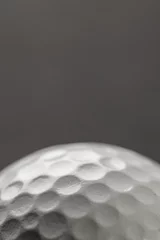 Photo sur Aluminium Golf Close up of white golf ball with copy space on grey background