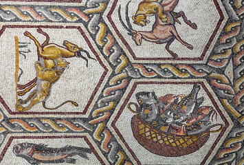 Animals on Fragment of Lod Mosaic, famous Roman mosaic floor in Lod town in Israel, displayed in Shelby White and Leon Levy Lod Mosaic Center. Mosaic depicts land animals, fish and two Roman ships.