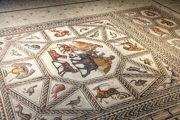 Fragment of Lod Mosaic, famous Roman mosaic floor in Lod town in Israel, displayed in Shelby White and Leon Levy Lod Mosaic Center. Mosaic depicts land animals, fish and two Roman ships.