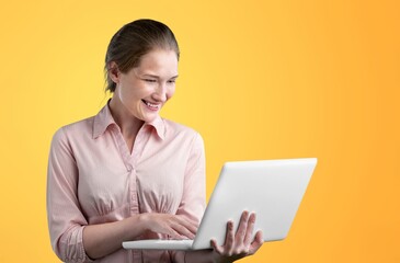 Happy business woman working with laptop