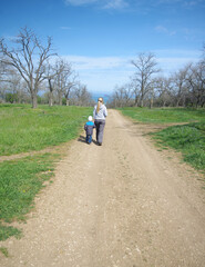 A woman and her son in a spring park.