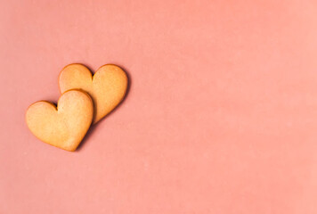 Heart-shaped cookies on colorful background. 