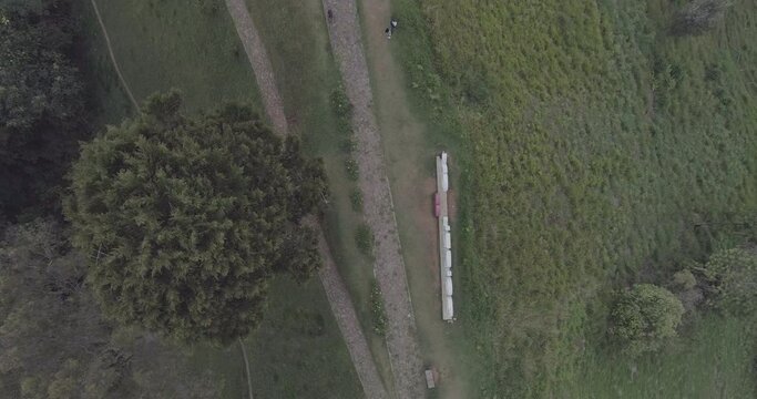 Large Letters Reading "I Love Jerico" in Spanish on a Path on a Hillside seen from Above - Shot in D-Log