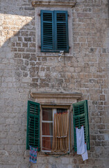 Laundry hanging outside a window in Old Town Kotor, Montenegro