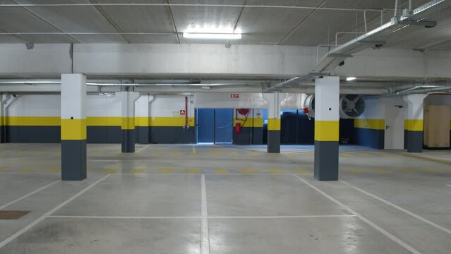 WS - steadicam shot of empty underground parking in the trade center