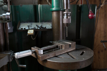 Part machining with drilling machine