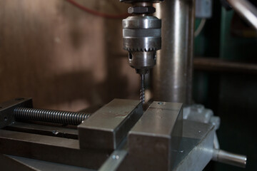 Part machining with drilling machine