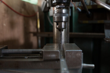 Part machining with drilling machine