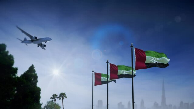 Airplane landing in Dubai, Emirates. A generic passenger plane lowering its landing gears as it approaches Dubai airport with Emirates flag waving.
