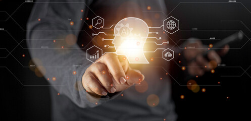 Businessman using light bulbs icon intelligence Ai. Chat bot with AI Artificial Intelligence, Futuristic technology, robot in online system.
