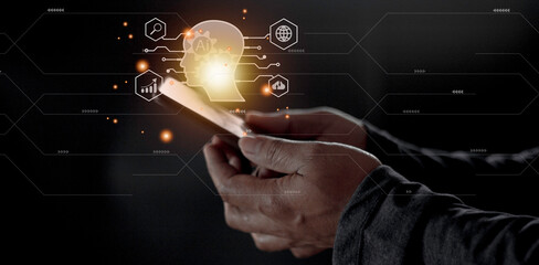 Businessman using light bulbs icon intelligence Ai. Chat bot with AI Artificial Intelligence, Futuristic technology, robot in online system.