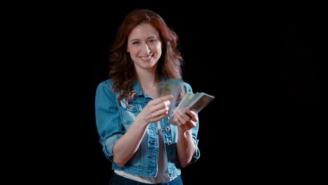 (Camera: ARRI ALEXA, 35mm lens, real time) A young caucasian woman smugly counts her money. For more variations of this clip, check out this seller's other videos.