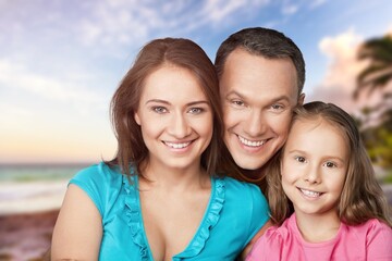 Fototapeta premium Happy young parents with cute child