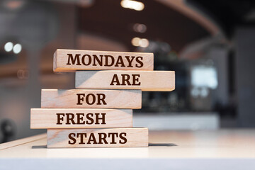 Wooden blocks with words 'Mondays are for fresh starts'.