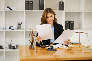 Female lawyer working at client's office discussing documents