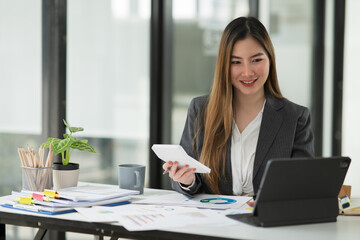 Asian business woman Working at the office, happy working day smile