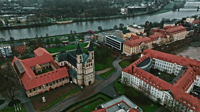 Drone shot revealing Kloster church (Klosterkirche) near Kunstmuseum Magdeburg - Kloster Unser Lieben Frauen (Kunstmuseum Magdeburg - Monastery Of Our Lady) , Magdeburg, Germany