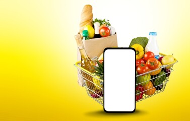 Big Smartphone and fresh food groceries, shopping concept